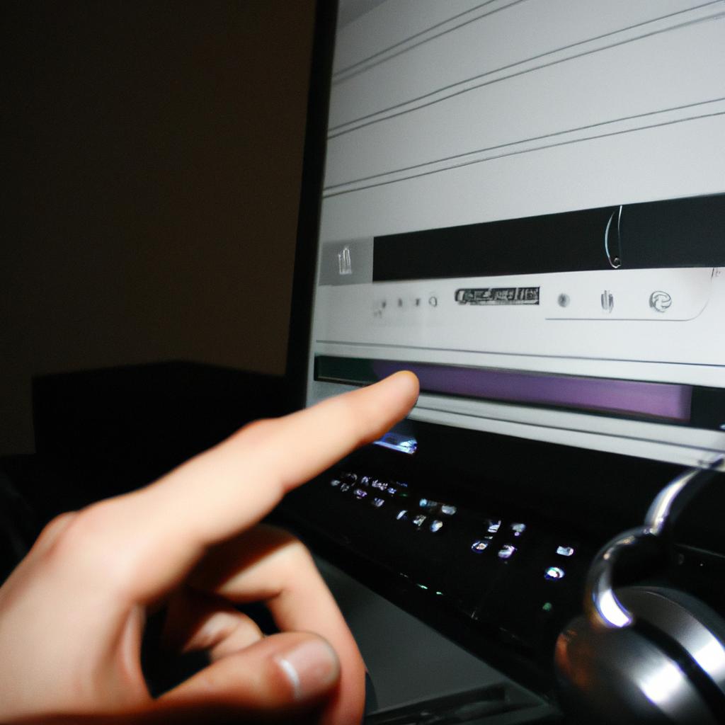 Person selecting music on computer