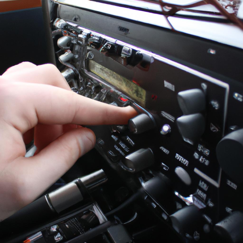 Person adjusting radio station settings