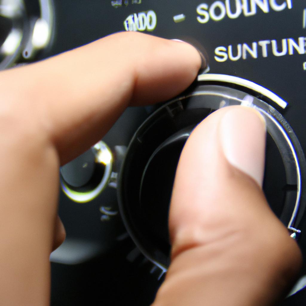 Person adjusting audio volume settings